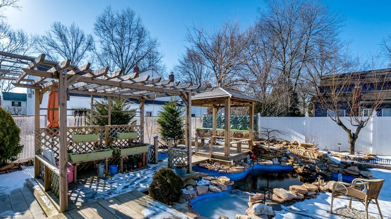Westbury Colonial with koi pond lists for 669,000 Newsday