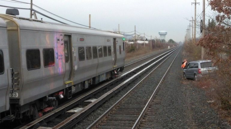 A vehicle sits in brush along the westbound Long Island...