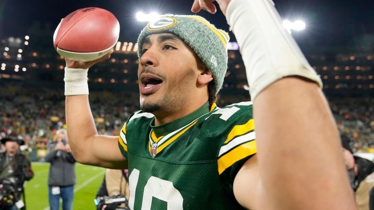 Jordan Love of the Packers celebrates defeating Kansas City at Lambeau Field...