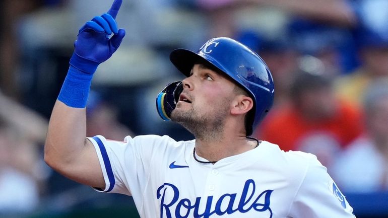 Kansas City Royals' Michael Massey celebrates as he crosses the...