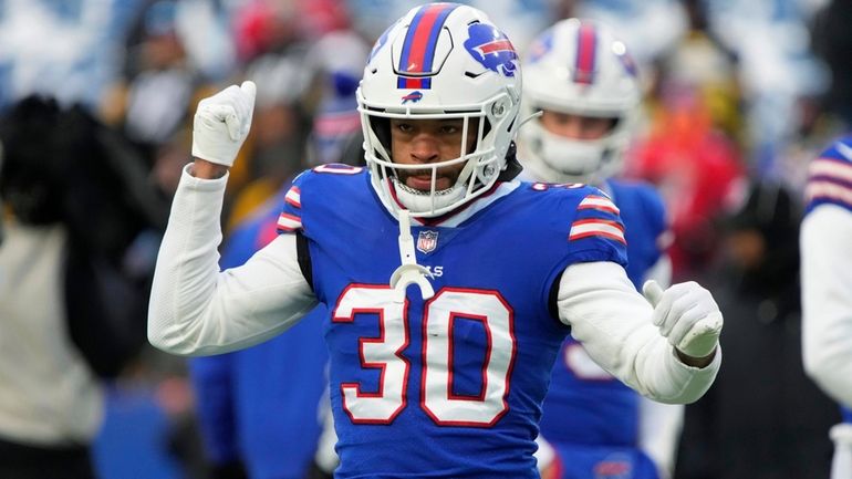 Buffalo Bills cornerback Dane Jackson warms up for the team's...