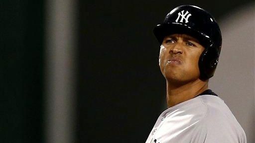 Alex Rodriguez grimaces at second base during the fifth inning...