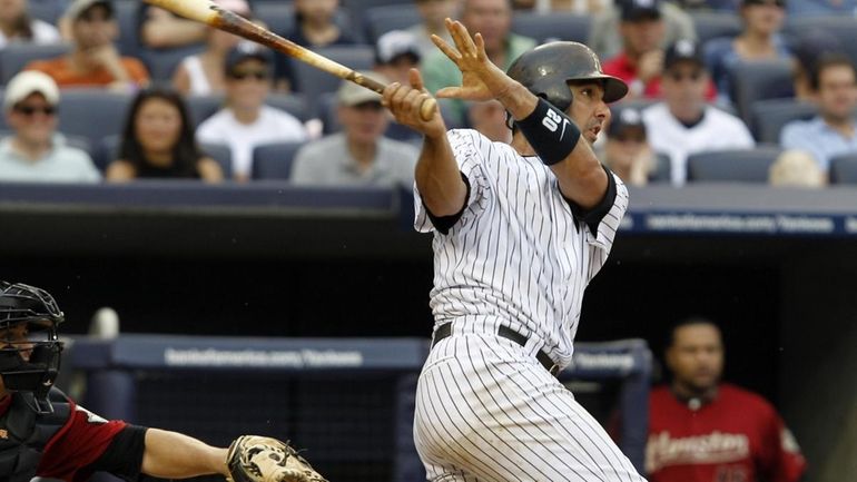 Yankee Jorge Posada watches his fifth-inning grand slam off Astros...