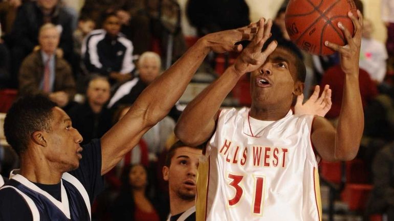 Half Hollow Hills West's Emile Blackman shoots past West Babylon's...