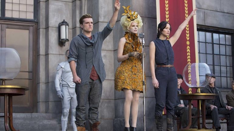 From left, Josh Hutcherson as Peeta Mellark, Elizabeth Banks as...