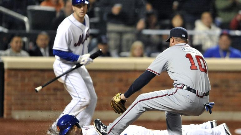 Atlanta Braves' third baseman Chipper Jones (10) is late covering...