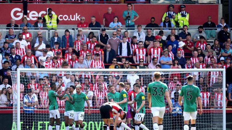 Newcastle United's Jacob Murphy, second left, celebrates scoring his side's...