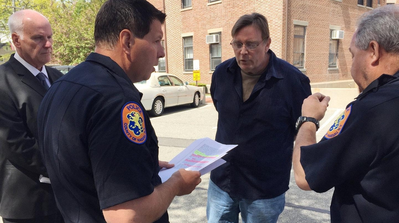 oyster-bay-town-critic-removed-from-board-meeting-by-police-newsday