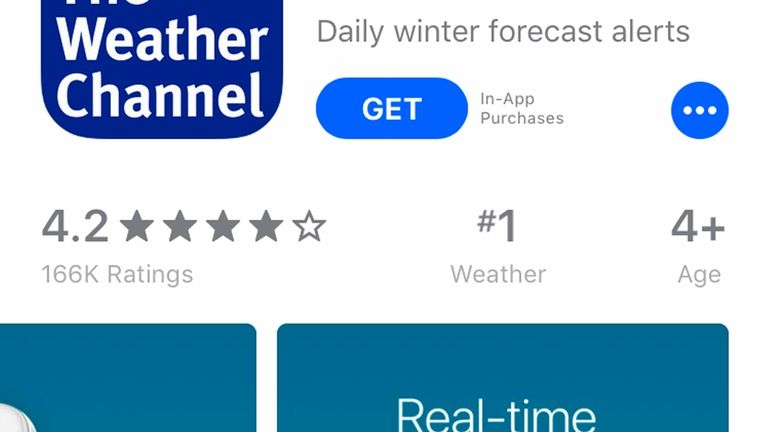 A mobile phone with The Weather Channel app, Jan. 4,...