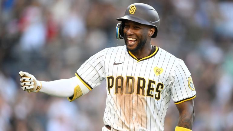 San Diego Padres' Jurickson Profar celebrates after hitting a two-run...