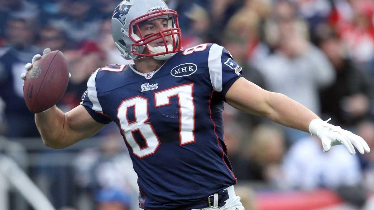 New England Patriots rookie tight end Rob Gronkowski grabs his first NFL  touchdown catch, next to Cincinnati Bengals linebacker Dhani Jones, during  the second half of New England's 38-24 win in an