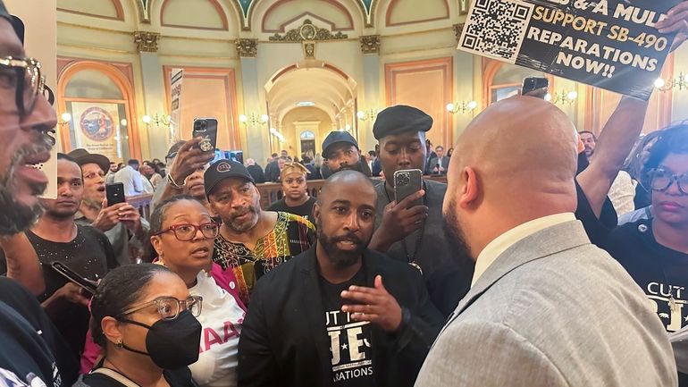 Assemblymember Isaac Bryan, right, talks to members of Coalition for...