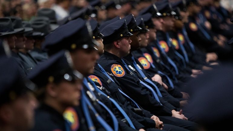 Graduates look on during the Nassau County Police Department Police...