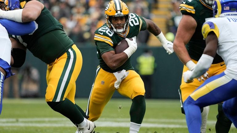 Green Bay Packers running back AJ Dillon (28) runs with...