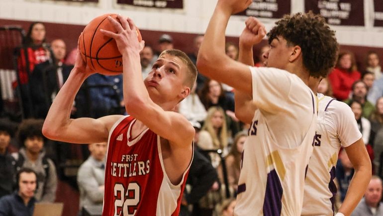 Southold's Travis Sepenoski looks to shoot against Austin Luke of...