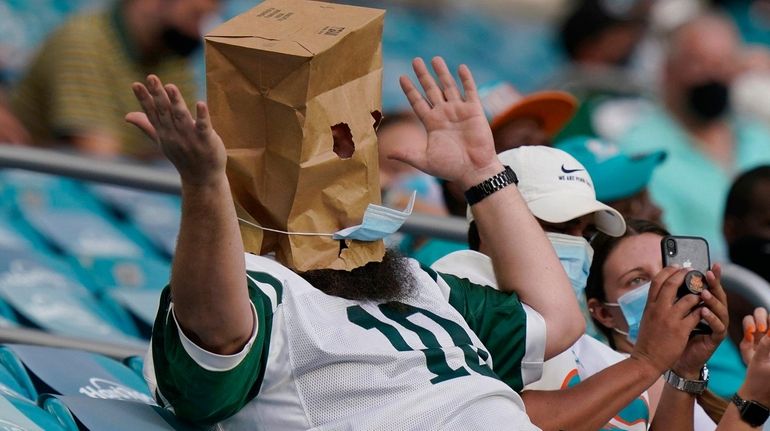 A New York Jets fans reacts to the team's performance...