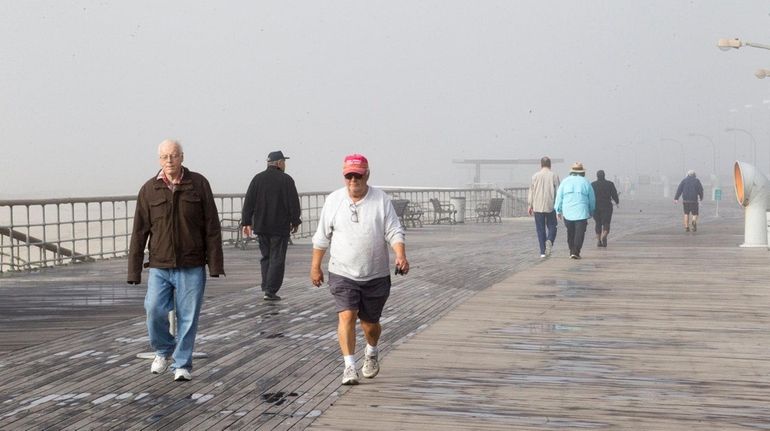 Fog greets beachgoers at Jones Beach in Wantagh on Friday,...