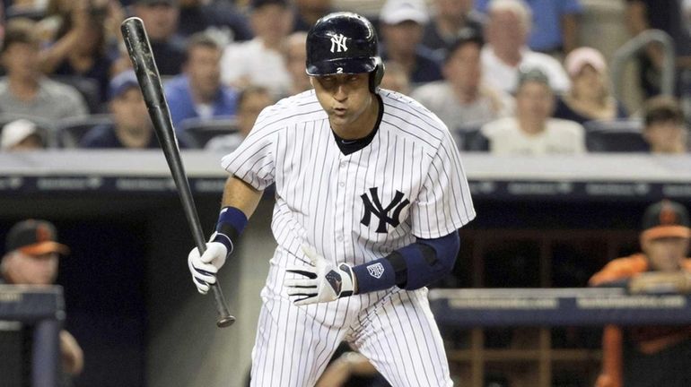 Yankees' Derek Jeter warches a foul ball in the first...