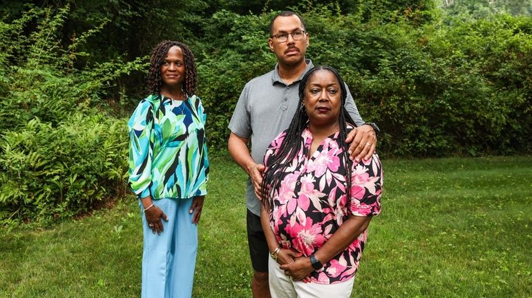 Jeanine and Ken Cox, of Central Islip, with Jessica Washington,...