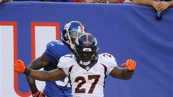 Denver Broncos running back Knowshon Moreno (no. 27) celebrates after...