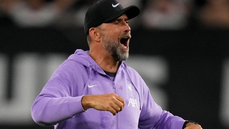 Liverpool's manager Jurgen Klopp celebrates after the Europa League group...