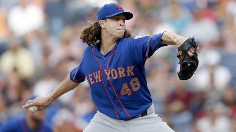 Mets starting pitcher Jacob deGrom works in the first inning...