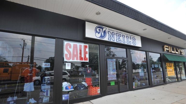 Shown is the sports clothing store, Neil's Corner Spot in...