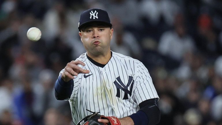 Yankees shortstop Isiah Kiner-Falefa (12) throws out Houston Astros first...