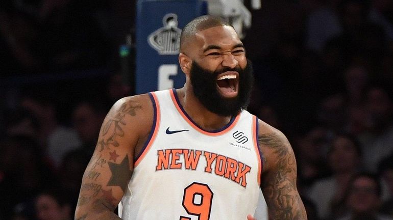 New York Knicks center Kyle O'Quinn reacts after sinking a...