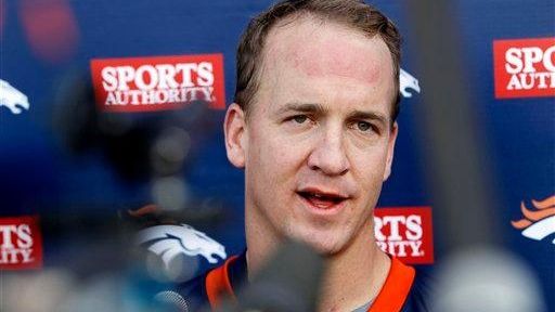 Denver Broncos quarterback Peyton Manning addresses the media after taking...