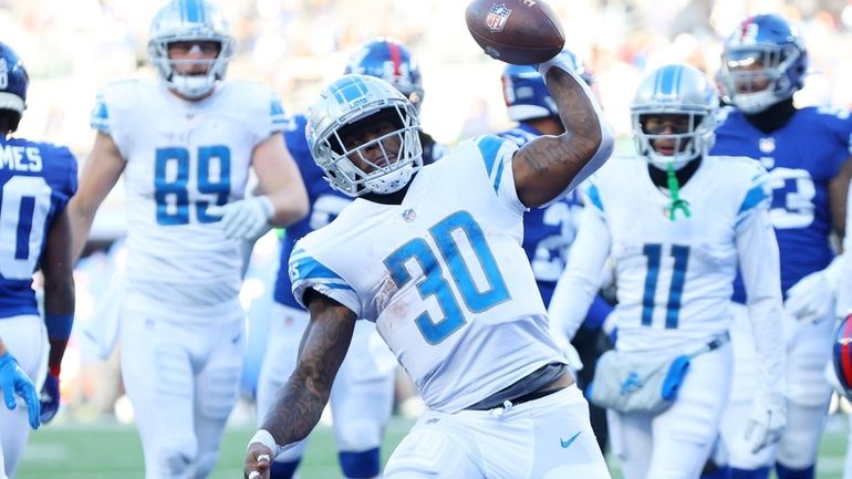 Jamaal Williams #30 of the Detroit Lions celebrates a rushing...