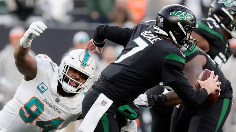 Christian Wilkins of the Miami Dolphins sacks Tim Boyle  of the...