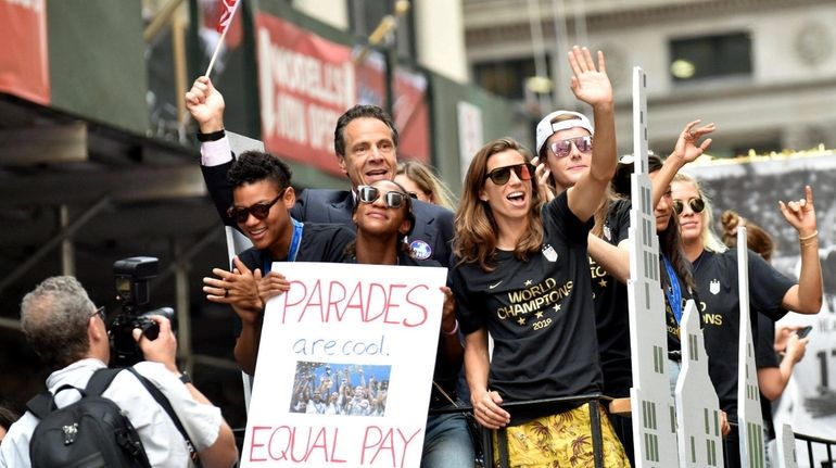 Gov. Andrew M. Cuomo signed the new legislation before the ticker-tape parade...