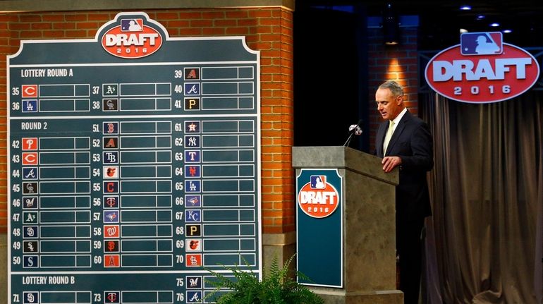 Commissioner Rob Manfred speaks during the MLB draft, in Secaucus,...