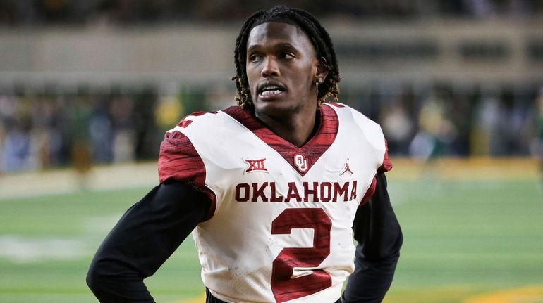 Oklahoma wide receiver CeeDee Lamb stands on the field during...