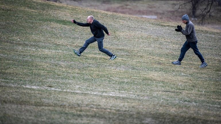 Walkers take to the hills in Eisenhower Memorial Park in...