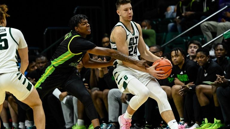 South Florida guard Brandon Stroud attempts to knock the ball...