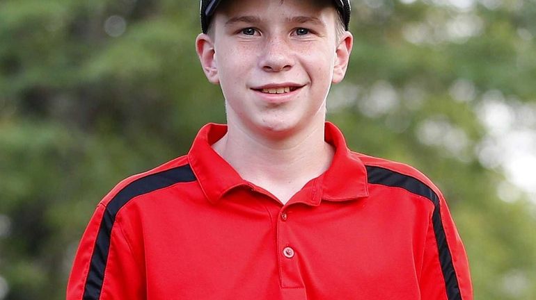 Sean Haselton poses with his first-place medal during a regional...