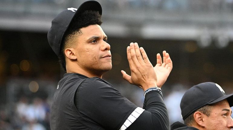 Yankees’ Juan Soto looks on from the dugout during a...