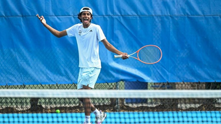 Aayan Mehta of Syosset reacts to a point during the...