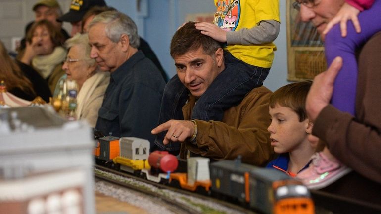 Daniel Lenzo, of Garden City, and his son Alex, 5,...