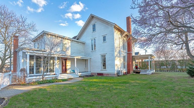 This Greenport home has two renovated kitchens and two living...