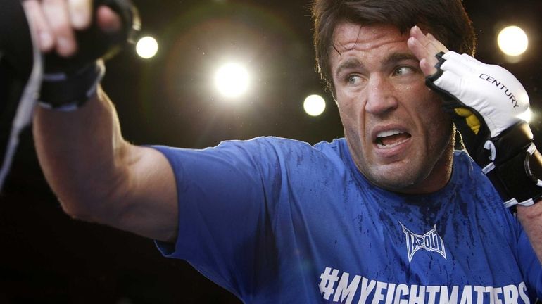 Chael Sonnen lands a punch during an open workout for...