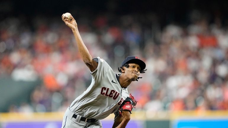 Cleveland Guardians starting pitcher Triston McKenzie throws against the Houston...