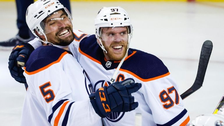 Edmonton Oilers center Connor McDavid, right, celebrates his goal against...