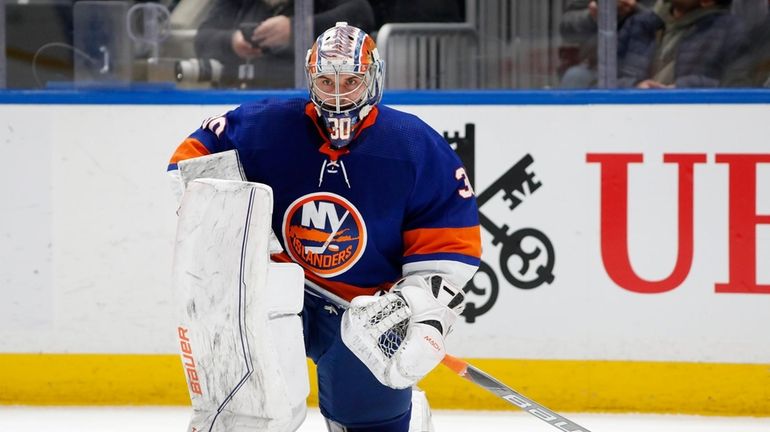 Ilya Sorokin #30 of the Islanders looks on during the second...