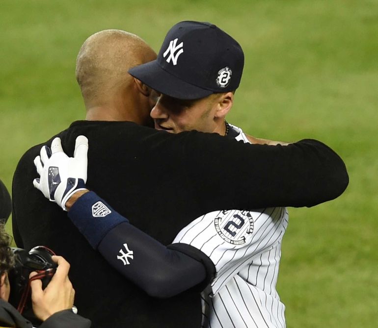 Derek Jeter and the entire New York Yankees team tip their hats to the fans  after the game against the Baltimore Orioles in the final game ever at  Yankee Stadium in New