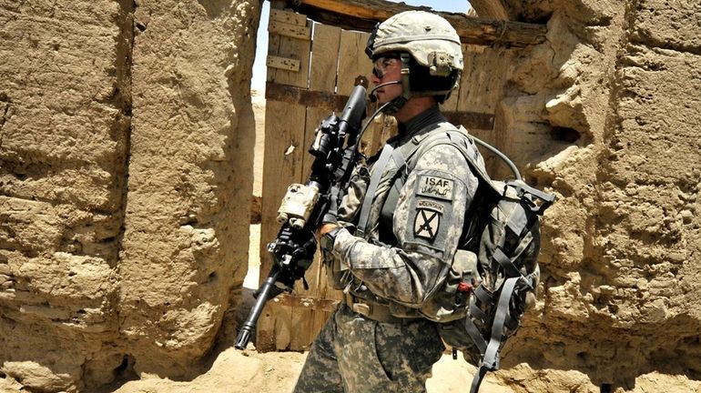 Joseph Theinert from Bravo Troop 1-71 CAV walks on patrol...