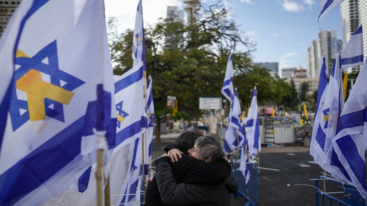 Middle East latest: Israel receives remains said to include a mother and her 2 young children