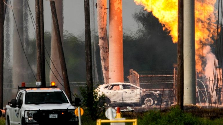 A massive pipeline fire burns after a vehicle drove through...